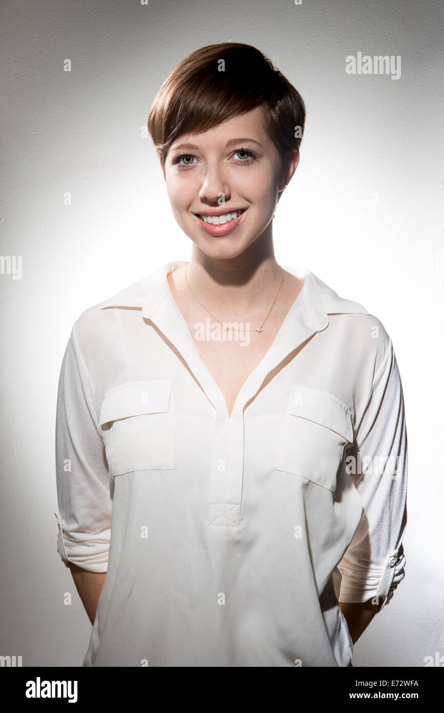 Portrait of young woman smiling Stock Photo