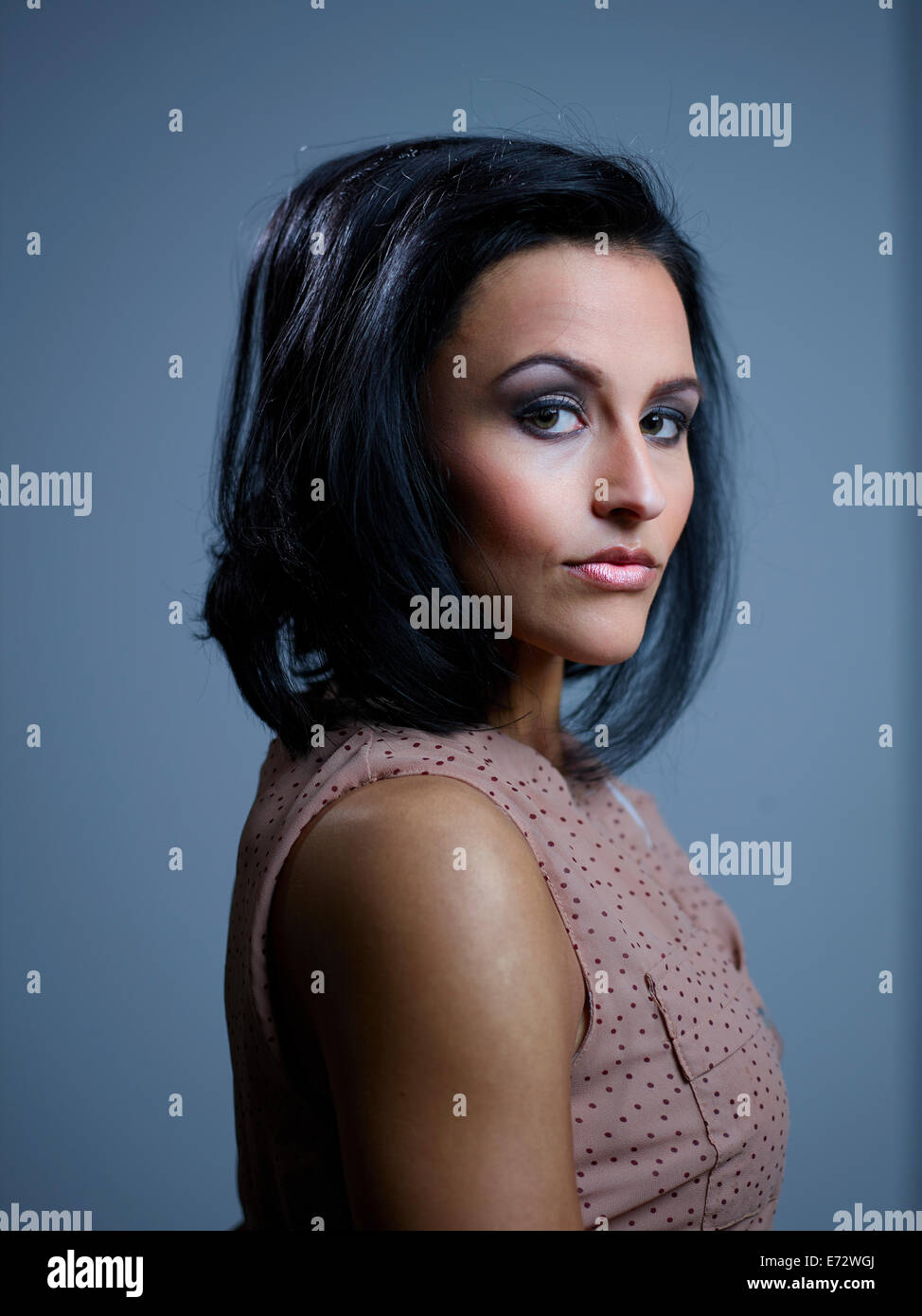 Studio portrait of a beautiful young woman Stock Photo - Alamy