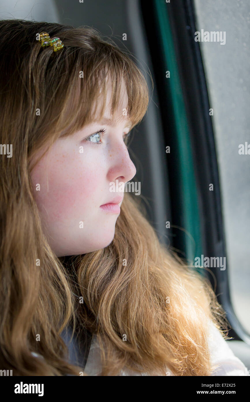 Portrait of teenage girl (13-15) inside car Stock Photo