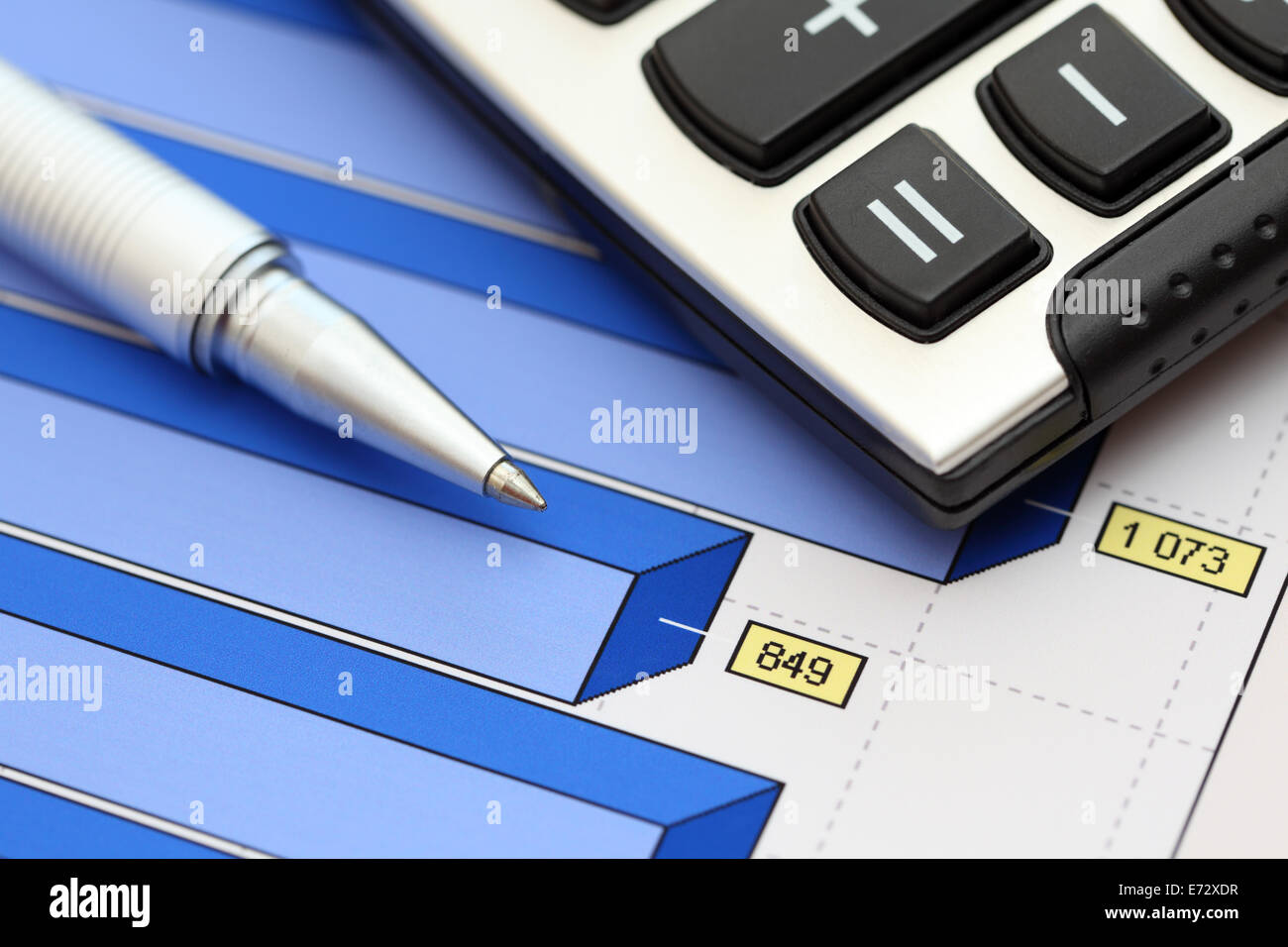 Financial statements. Business Graph. ballpoint pen and calculator on a financial chart or Stock Market Data. Stock Photo