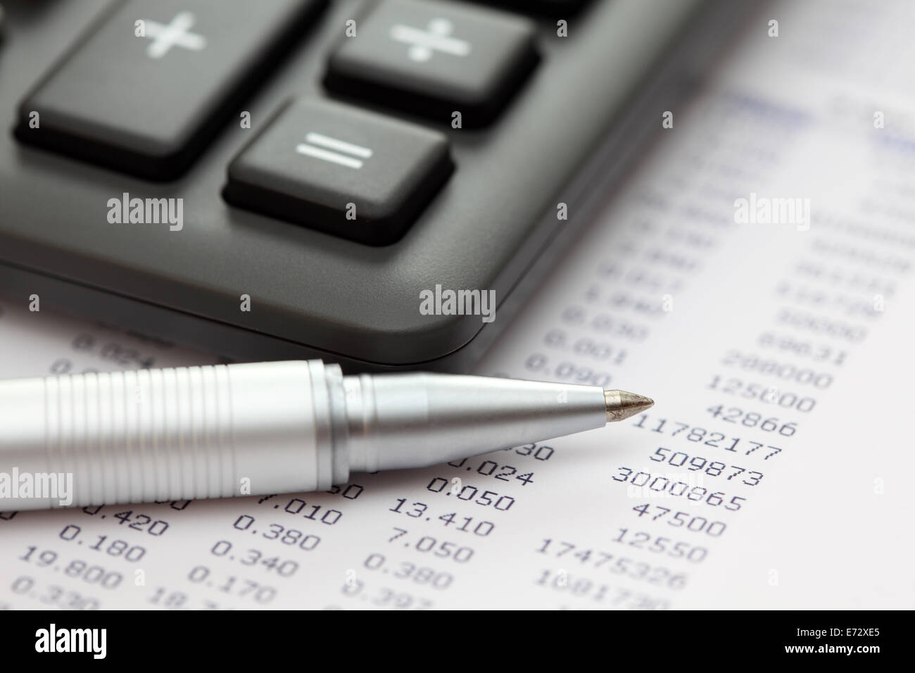 Financial statements. Calculator, ballpoint pen on financial statements. SDOF. Close-up. Stock Photo