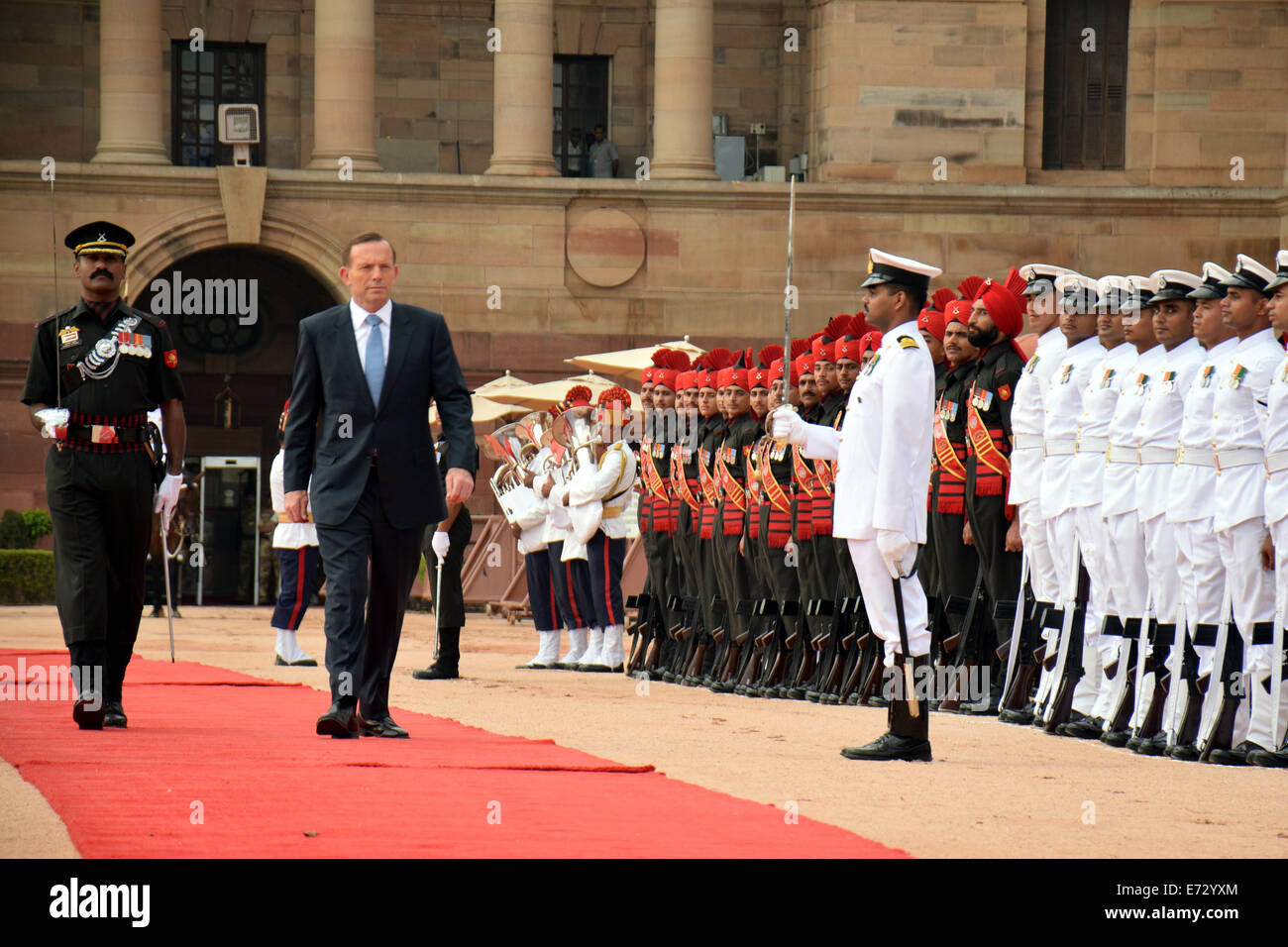 New Delhi, India. 5th Sep, 2014. Australian Prime Minister Tony Abbott (C) inspects the honor guards during a welcoming ceremony at the Presidential Palace in New Delhi, capital of India, on Sept. 5, 2014. Credit:  Partha Sarkar/Xinhua/Alamy Live News Stock Photo