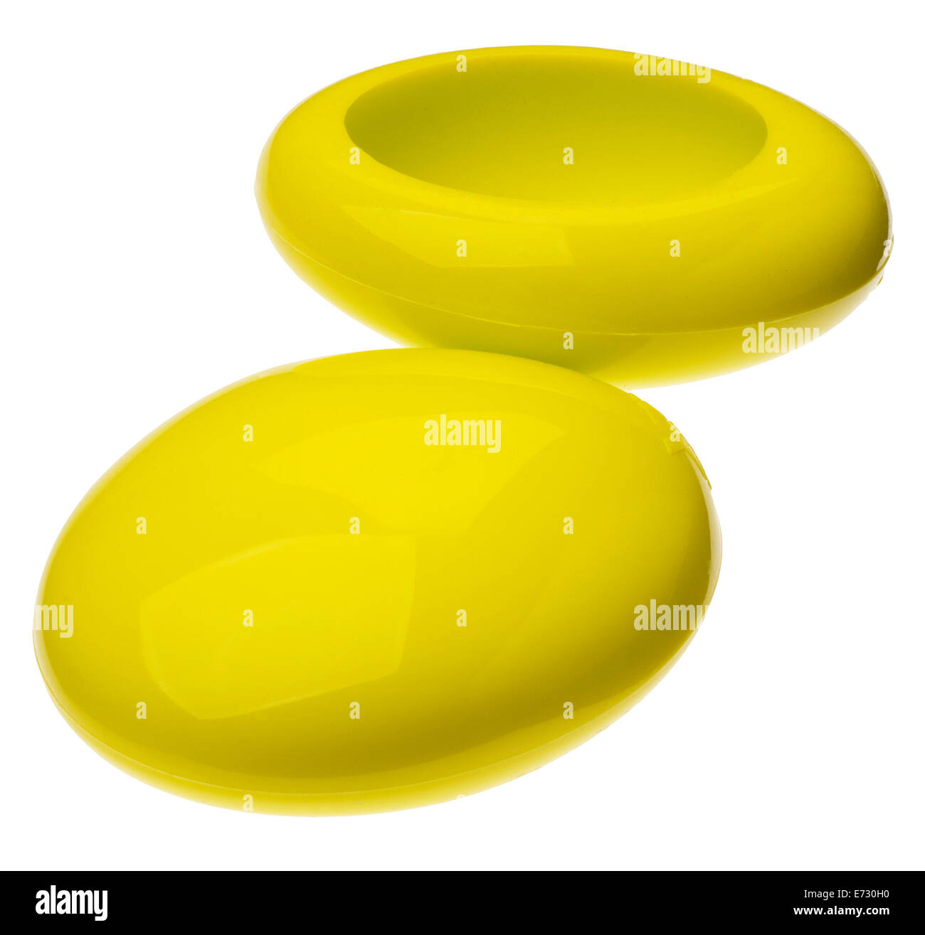 A pair of yellow silicone cups for supporting laptops, tablet computers or keyboards. Stock Photo