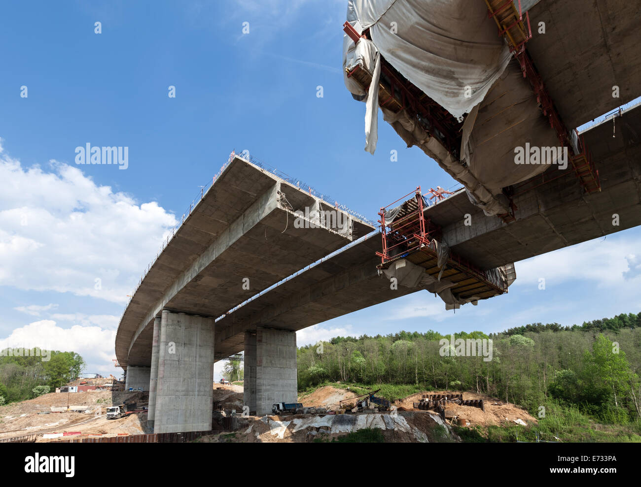 Construction of the bridge by the prestressed concrete method Stock Photo