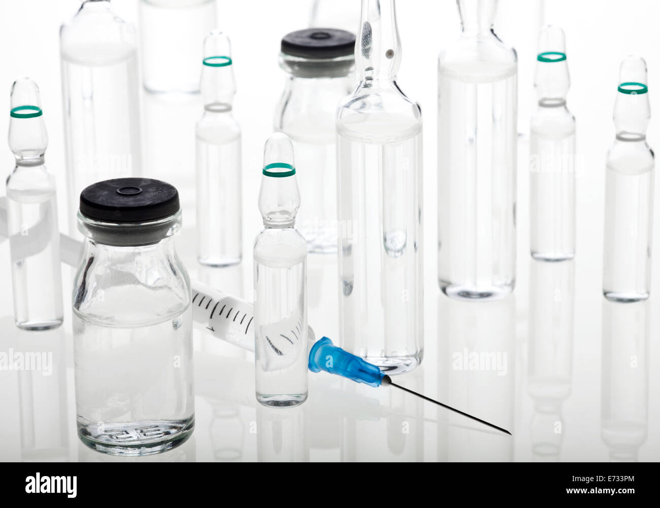 Glass Medicine Vials with liquid, ampoules and syringe Stock Photo Alamy