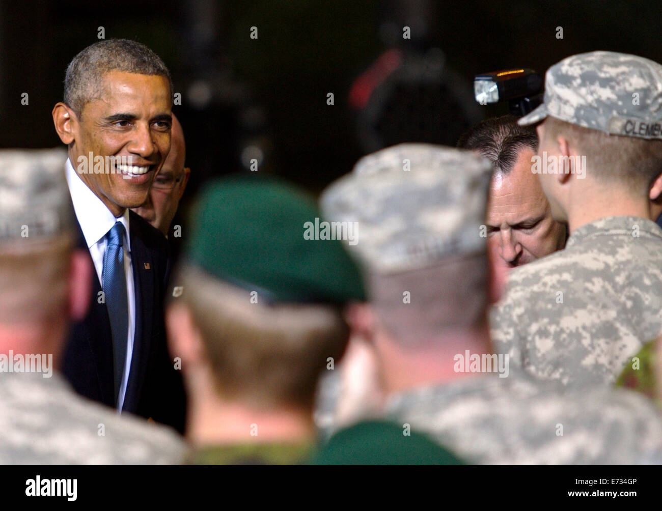 US President Barack Obama greets paratroopers from the U.S. Army 173rd Airborne Brigade and Estonian soldiers from the Estonian Single Scouts Battalion during a visit September 3, 2014 in Tallinn, Estonia. The 173rd Airborne Brigade is currently conducting combined training missions in Poland, Estonia, Latvia and Lithuania in support of NATO. Stock Photo