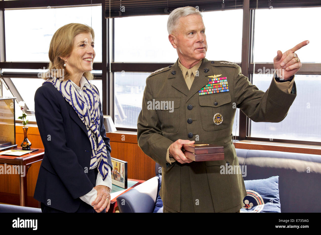 Commandant of the U.S. Marine Corps Gen. James F. Amos speaks with U.S. Ambassador to Japan Caroline Kennedy during a visit to the U.S. Embassy April 15, 2014 in Tokyo. Stock Photo