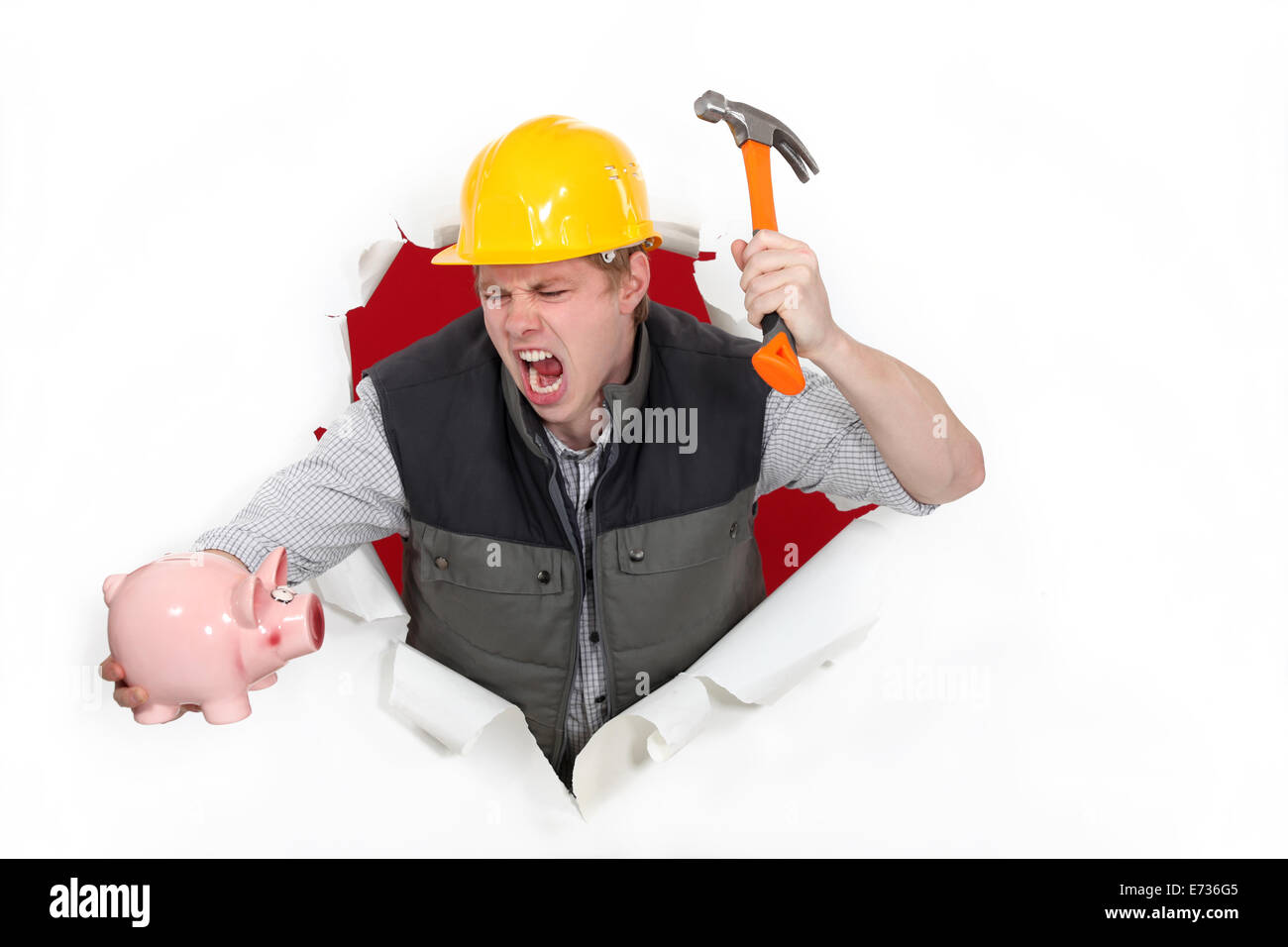 About to smash a piggy bank Stock Photo - Alamy