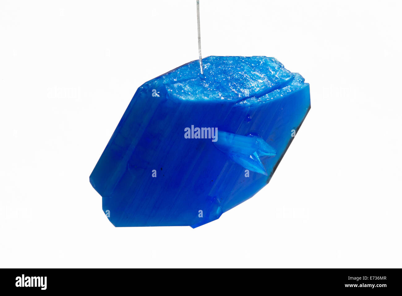 A copper sulphate crystal on a piece of twine grown as a school science project illustrating crystallization Stock Photo