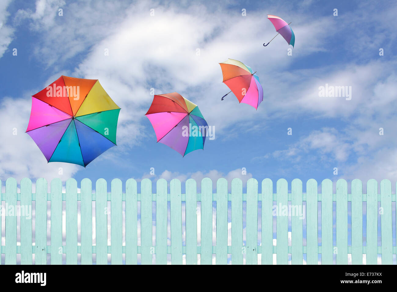 colorful umbrellas flying in a rich blue sky.conceptual image Stock ...