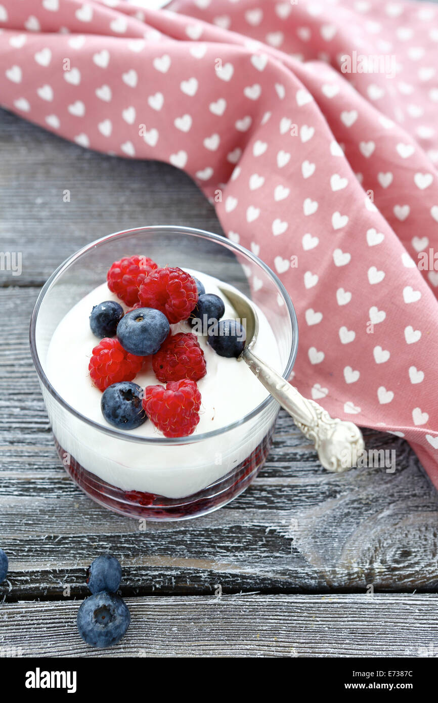 berry yogurt in a glass, food closeup Stock Photo