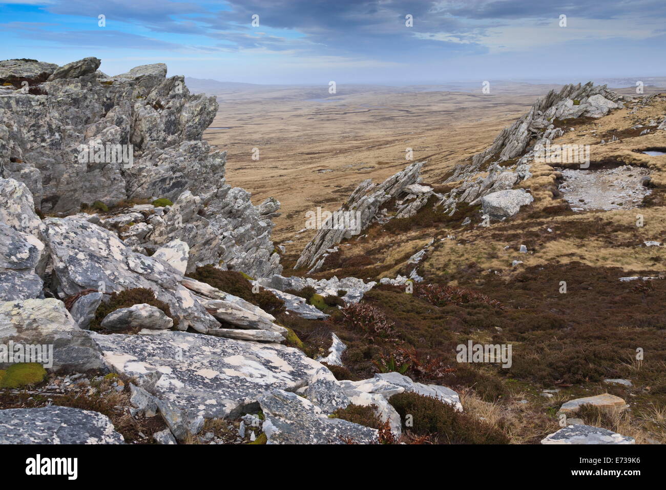 Exposed jagged rocks and distant view, Mount Longdon, East Falkland, Falkland Islands, South America Stock Photo