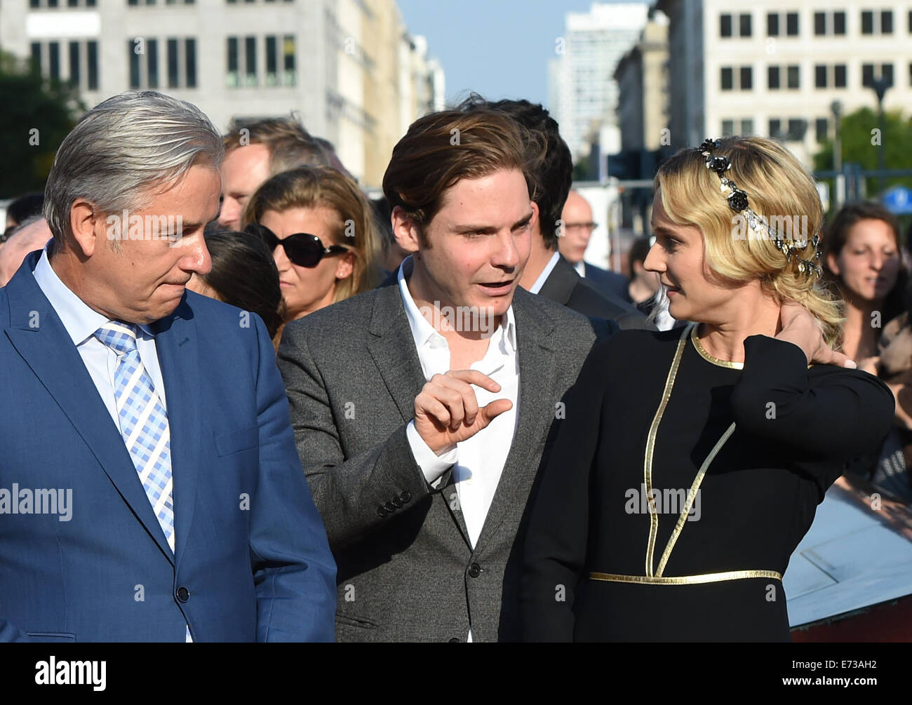 Potsdamer Platz, Berlin, Germany. 4th Sep, 2014. The Governing Mayor of Berlin Klaus Wowereit (L-R), actor Daniel Bruehl, and actress Diane Kruger talk at the re-opening ceremony of 'Boulevard of the Stars' at Potsdamer Platz, Berlin, Germany, 4 September 2014. There are 101 stars on the boulevard representing German film and TV celebrities. Photo: Jens Kalaene/dpa/Alamy Live News Stock Photo