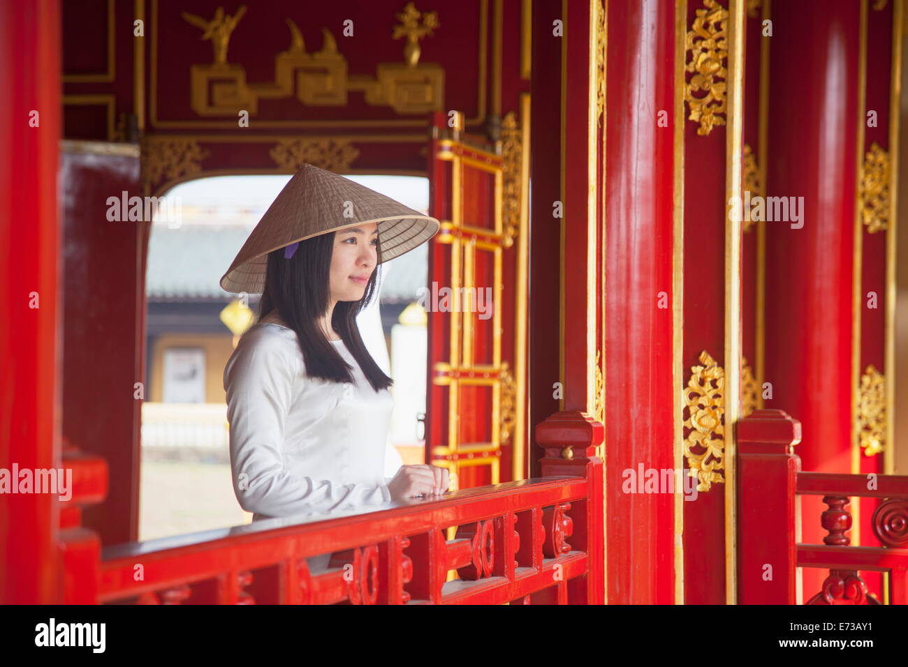 Woman wearing Ao Dai dress in Imperial Palace inside Citadel, Hue, Thua Thien-Hue, Vietnam, Indochina, Southeast Asia, Asia Stock Photo