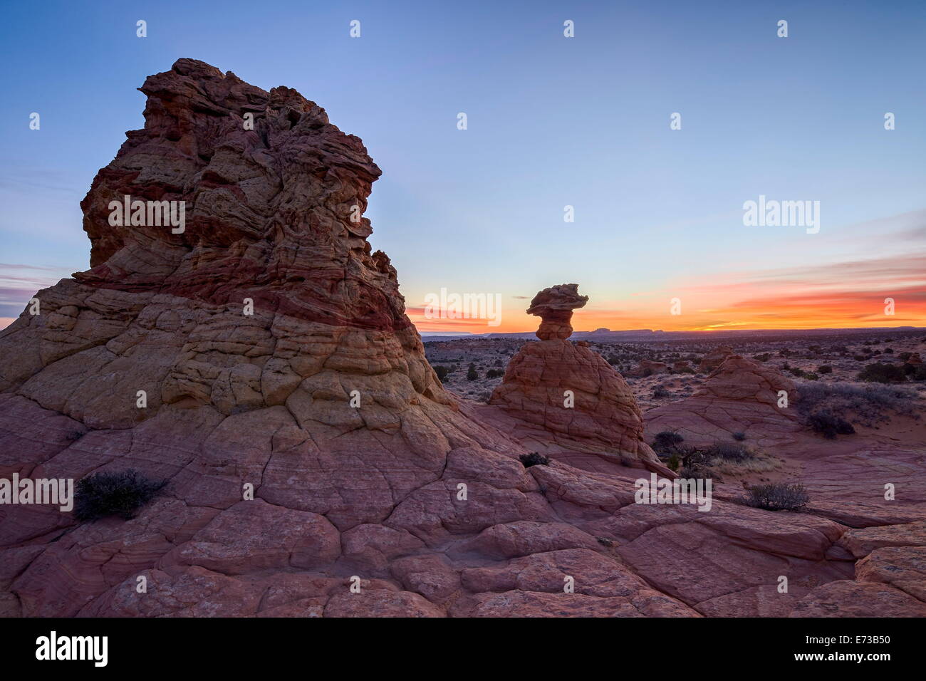 Sandstone formation at dawn with orange clouds, Coyote Buttes Wilderness, Vermilion Cliffs National Monument, Arizona, USA Stock Photo