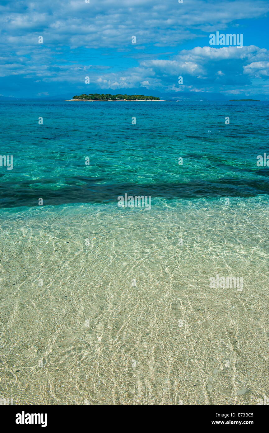 Clear waters on Beachcomber Island with a little islet in the background, Mamanucas Islands, Fiji, South Pacific, Pacific Stock Photo