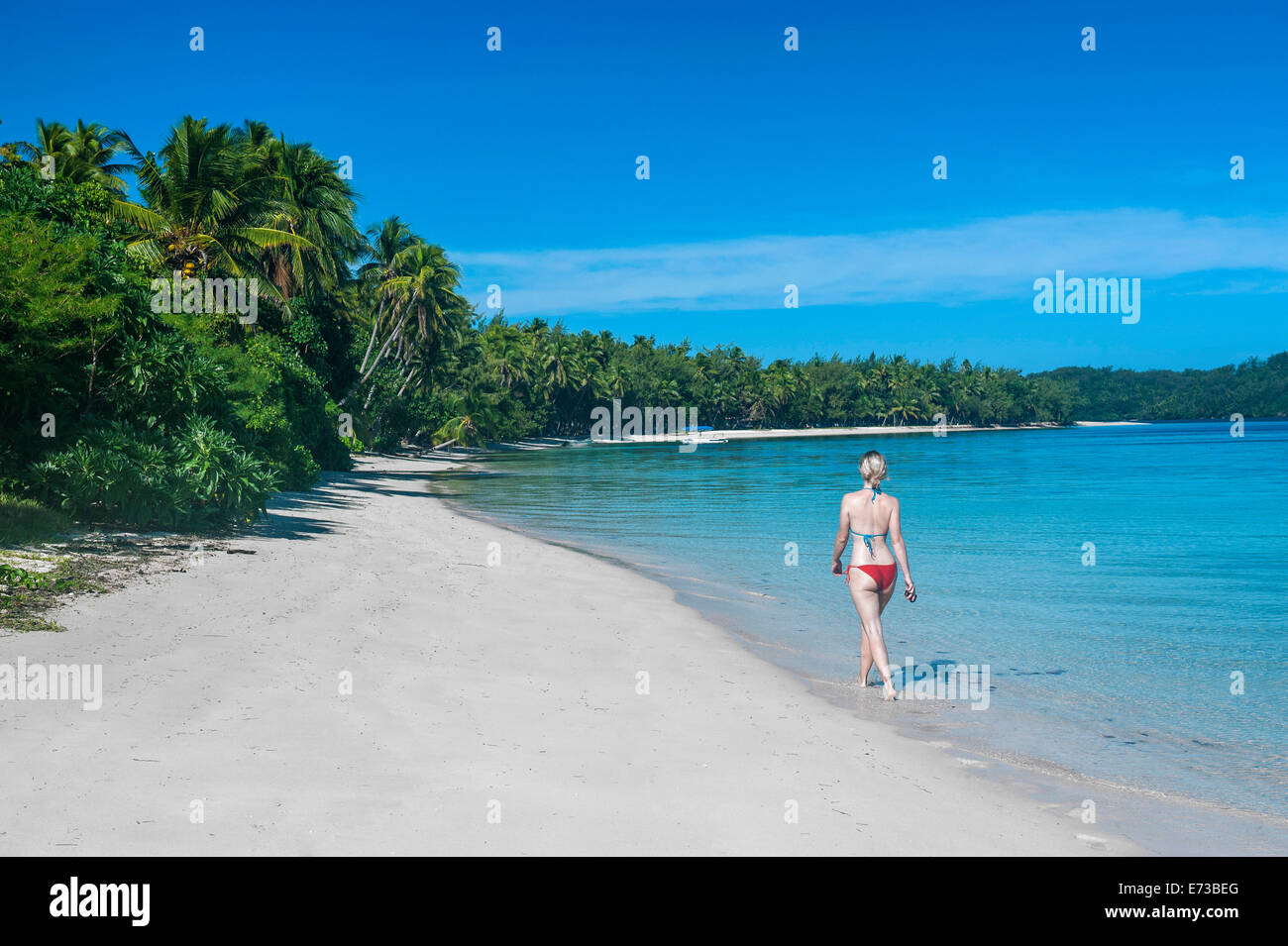Woman walking on a a white sand beach, Nanuya Lailai island, the blue lagoon, Yasawas, Fiji, South Pacific, Pacific Stock Photo