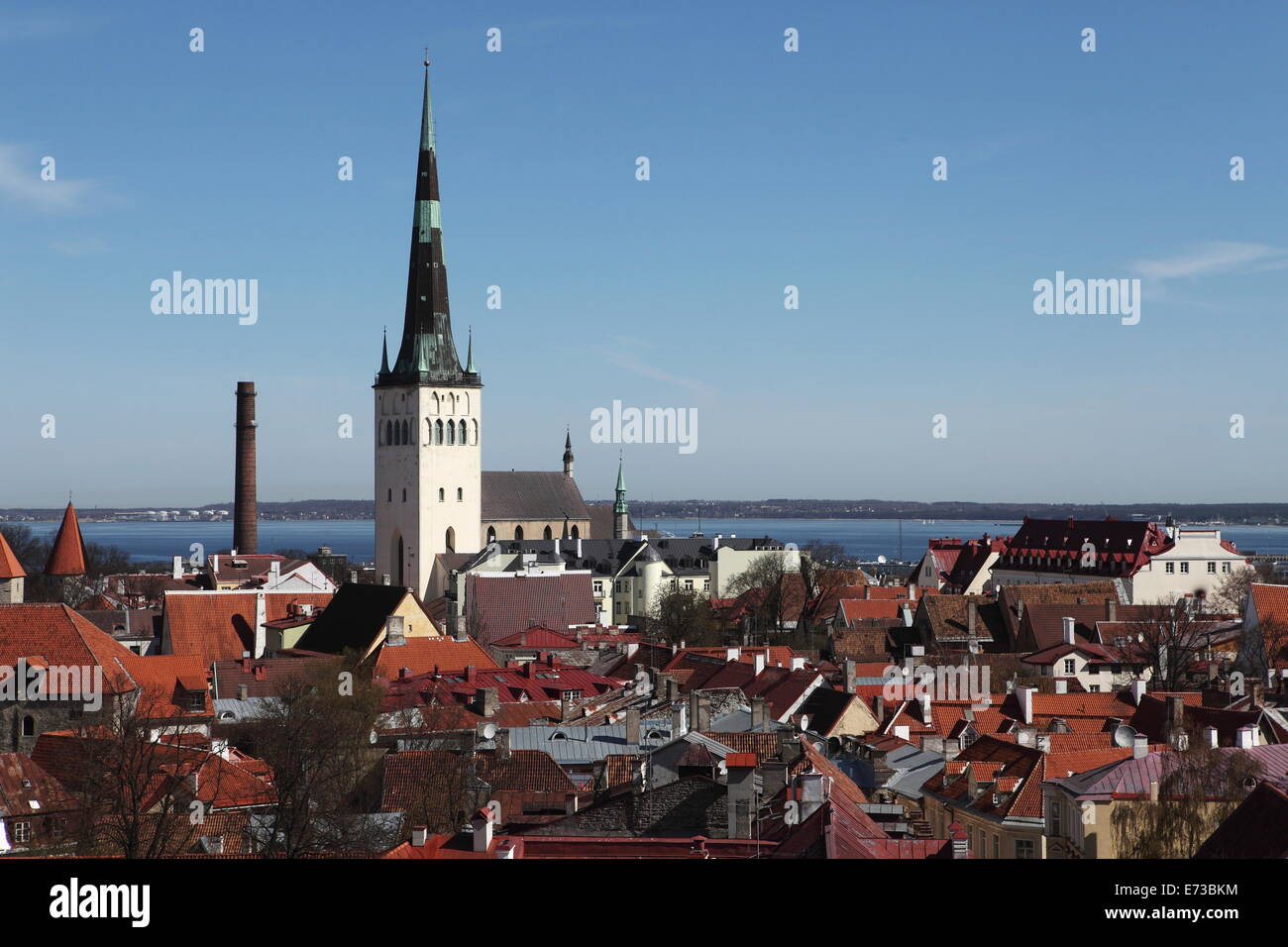 The spire of St Olaf's Church on the city skyline of Tallinn, Estonia, by the Gulf of Finland Stock Photo