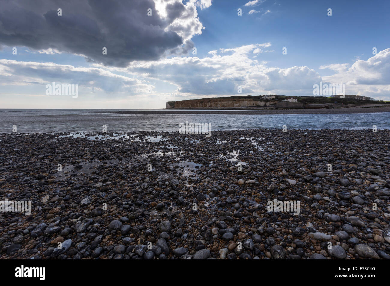 Pebble beach and Cliffs at Cuckmere Haven, Seaford, East Sussex, England, United Kingdom Stock Photo