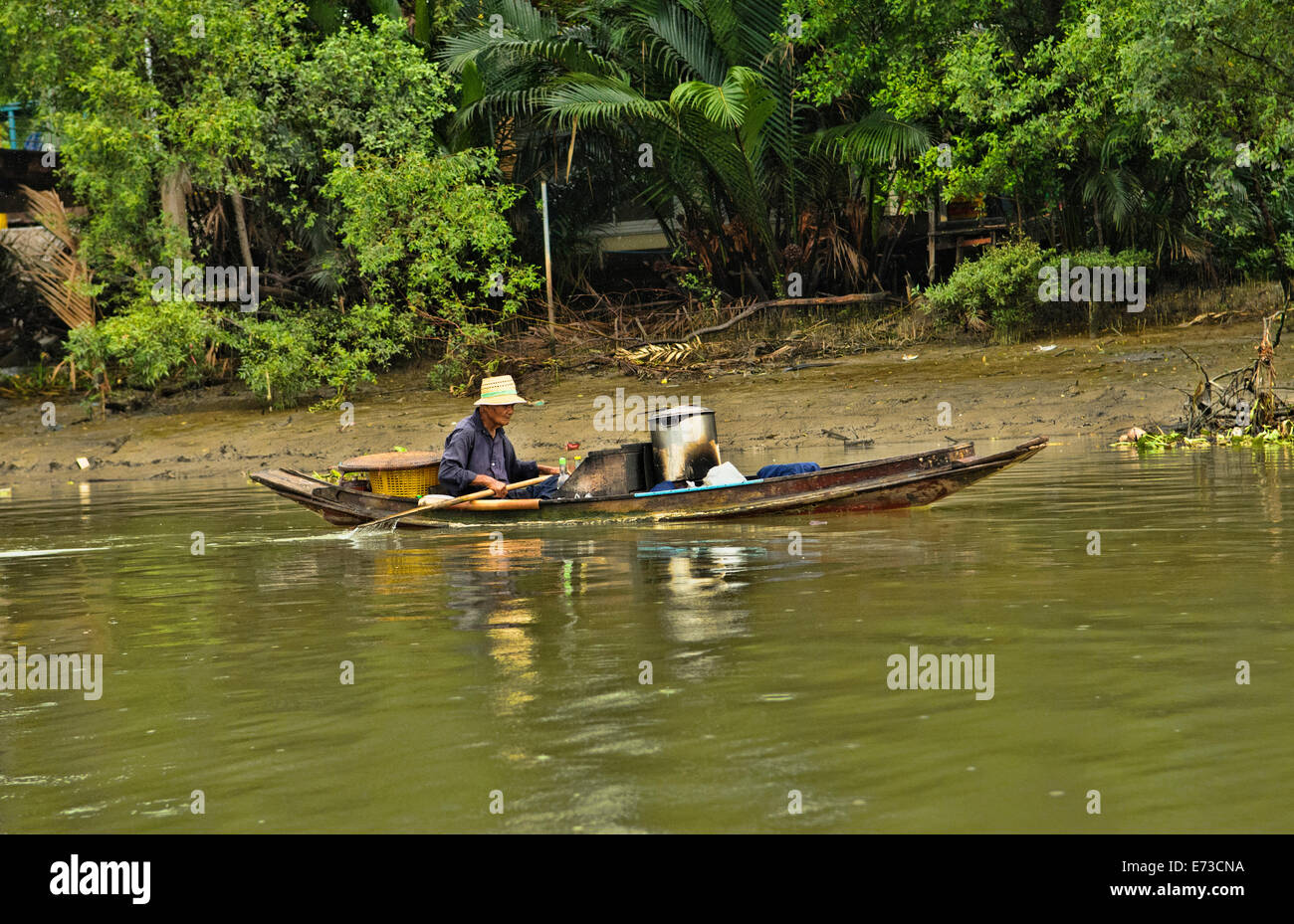 Vendor seller old man boat floating market tourist attraction destination hires stock