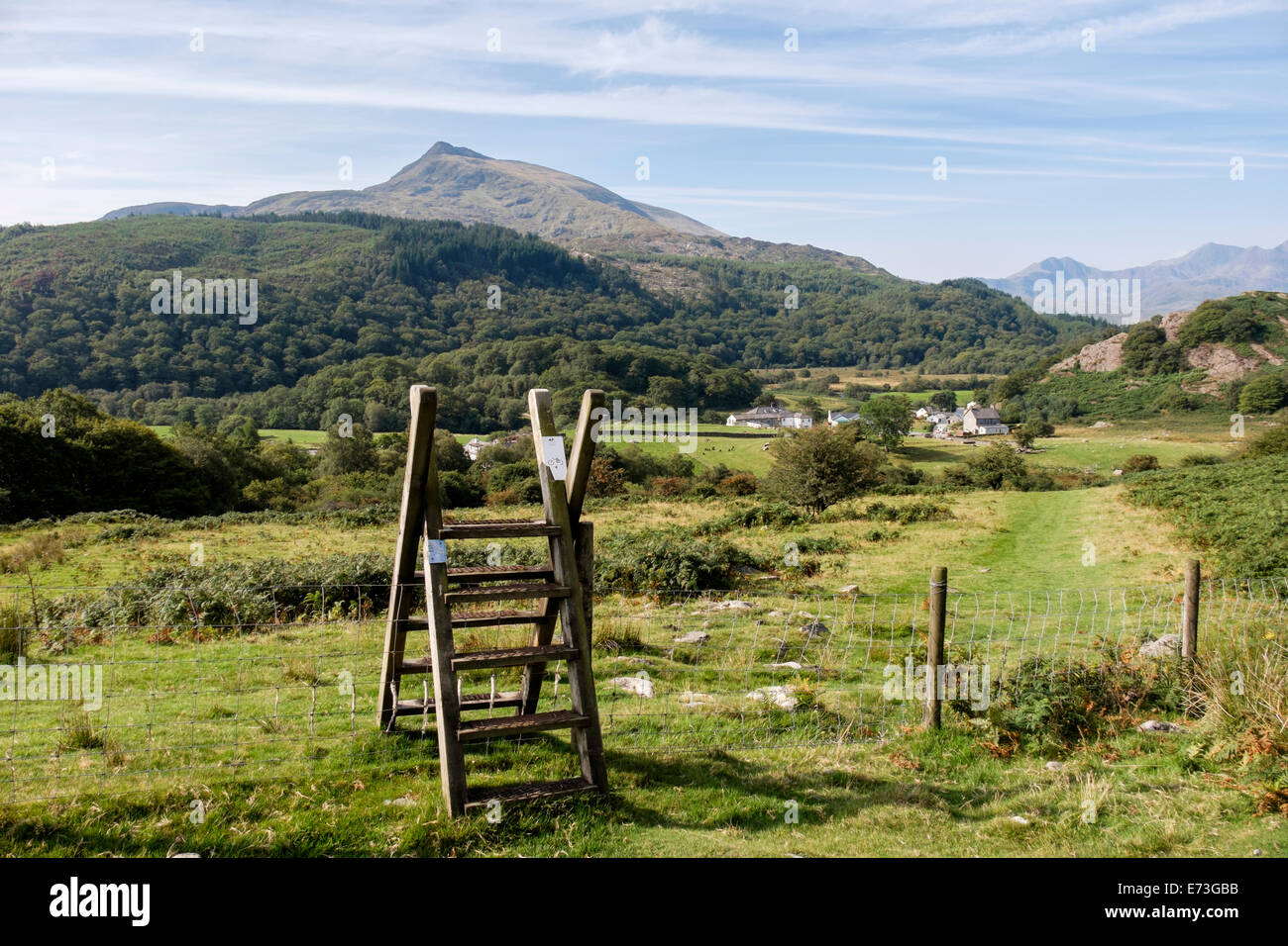 Ladder stile and view across valley to Carnedd Moel Siabod mountain in Snowdonia National Park (Eryri). Capel Curig Conwy Wales UK Stock Photo