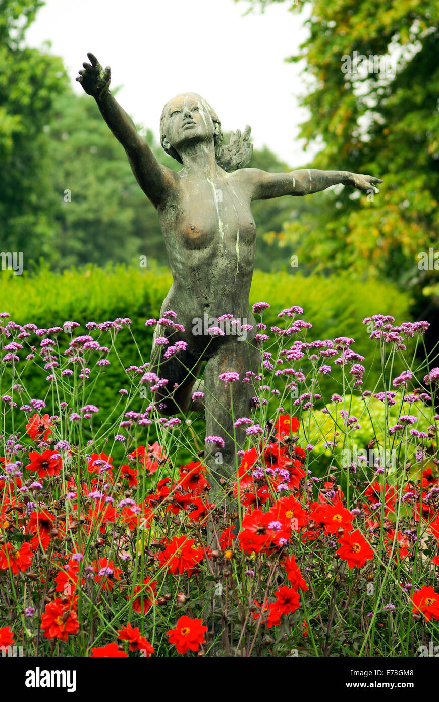 Nude statue of a young woman posing in a flower bed at Rode Hall Stock  Photo - Alamy