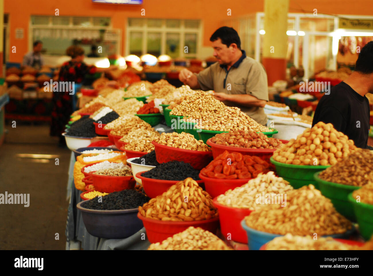 Tajikistan, Khujand, selling dry fruits and nuts in central market bazaar. Stock Photo