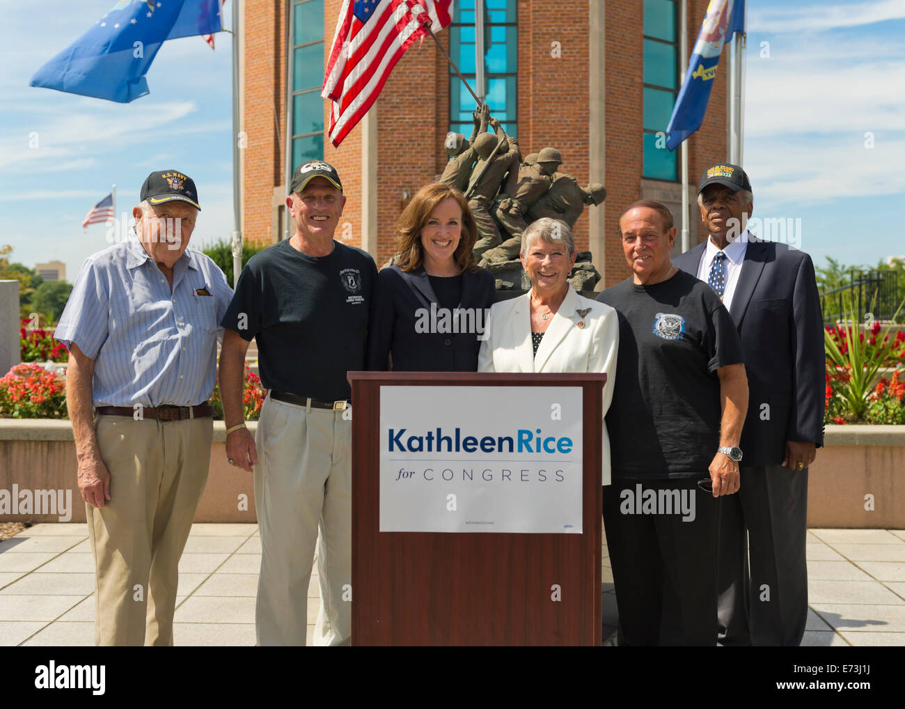 East Meadow, New York, USA. 3rd September, 2014.  At center, KATHLEEN RICE (in black), Democratic congressional candidate (NY-04), and outgoing Representative CAROLYN MCCARTHY (in white) are at Veterans Memorial at Eisenhower Park, after they toured Northport VA Medical Center. Rice released a whitepaper on veterans policy and announced the formation of her campaign's new Veterans Advisory Committee, and 4 of its members participated at the press conference: PAUL ZYDOR, (in blue shirt) of Merrick, U.S. Navy, Korean War Veteran; PAT YNGSTROM, (in black T-shirt and cap) of Merrick, U.S. © Ann E Stock Photo