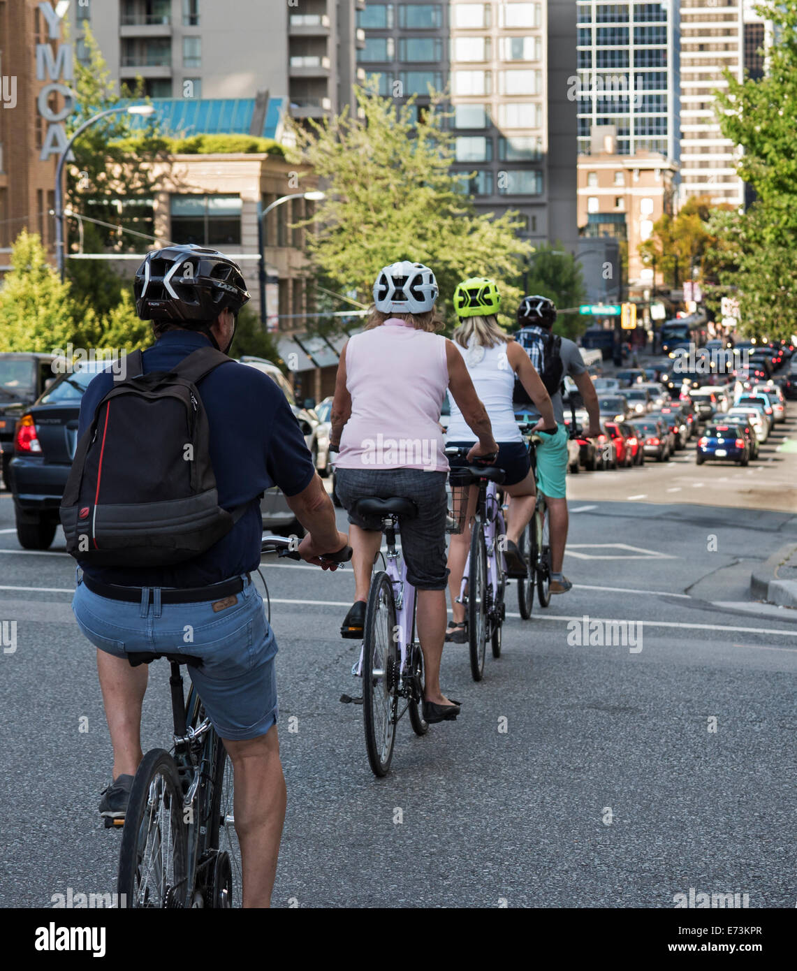 Bike riding on city streets,downtown Vancouver, Canada Stock Photo