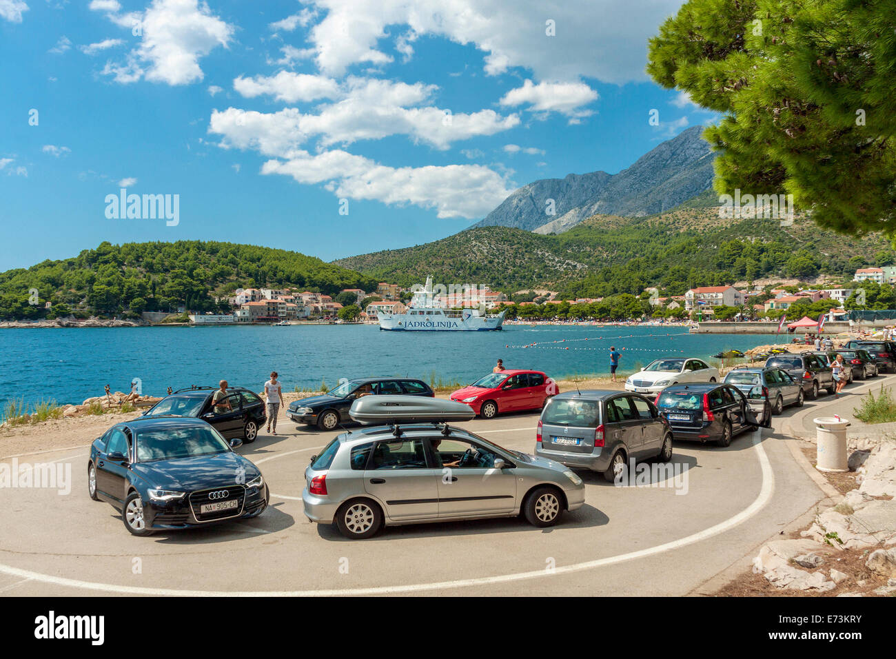 Queue of cars waiting for a ferry from Drvenik to Sucuraj, Drvenik, Croatia Stock Photo