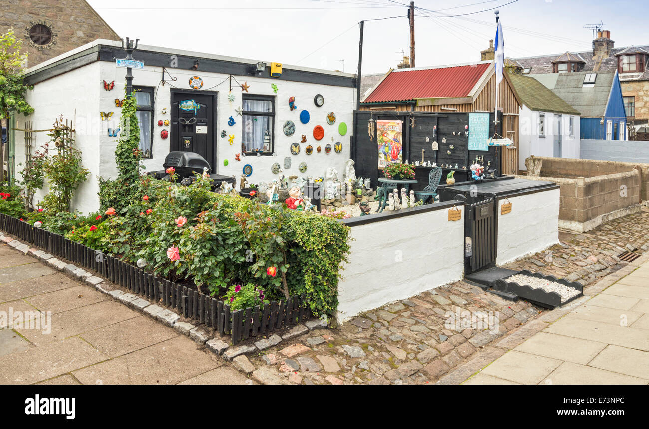 FOOTDEE OR FISHING VILLAGE IN ABERDEEN HARBOUR ROW OF SHEDS ONE HIGHLY