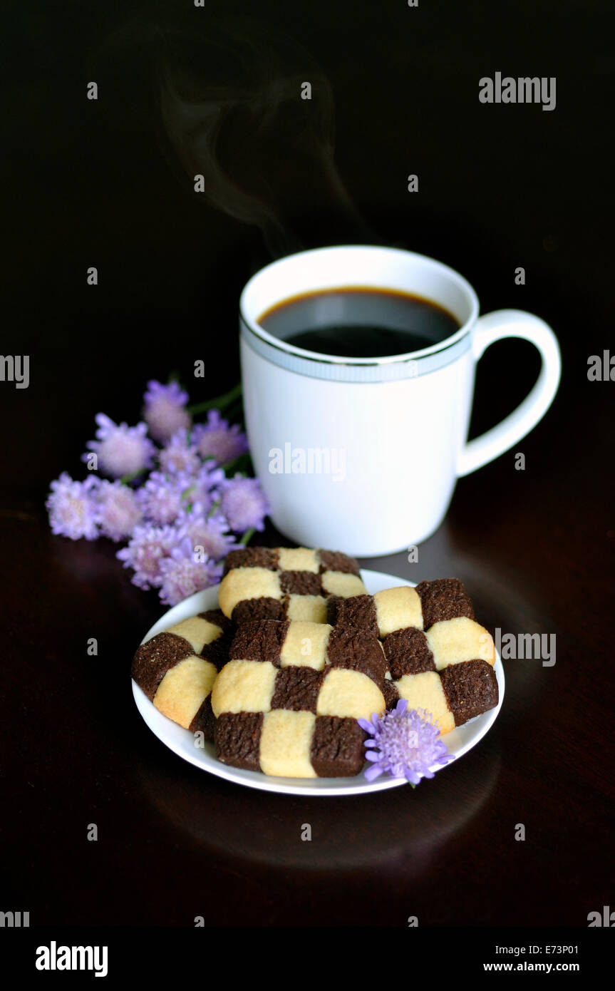 Coffee and checkered cookies Stock Photo