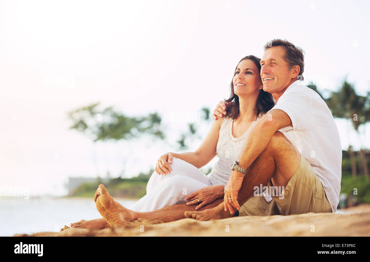 Happy Romantic Mature Couple Enjoying Sunset on the Beach Stock Photo ...