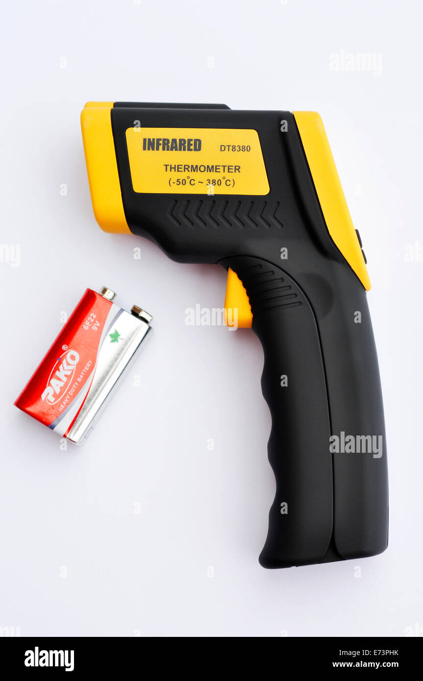 Hand held thermometer and battery Stock Photo Alamy