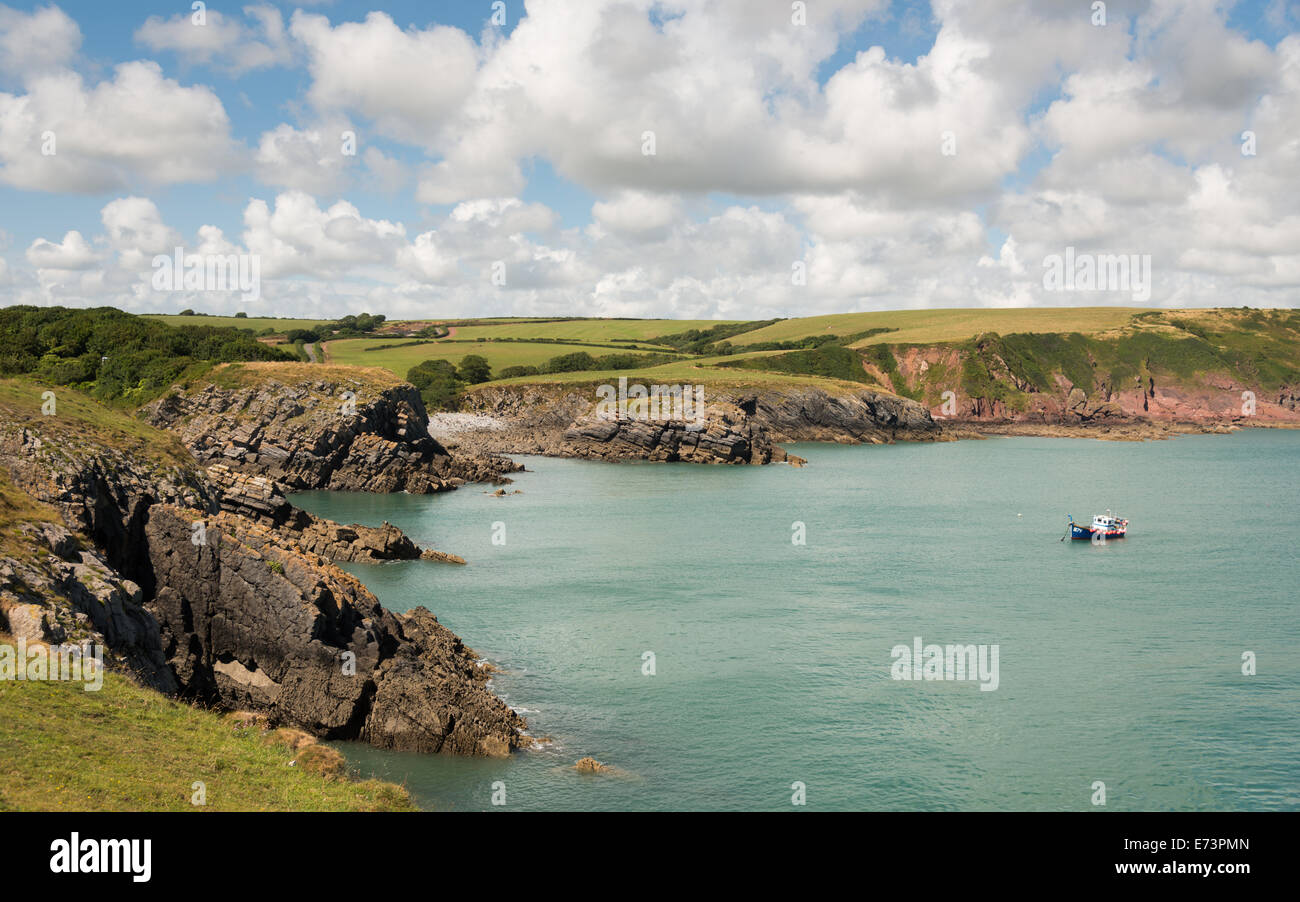 A boat moors opposite Stackpole Quay, Pembrokeshire, west Wales, UK ...