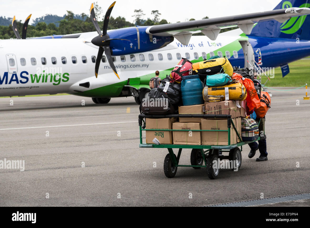 Baggage handling at airport, Mulu, Malaysia Stock Photo