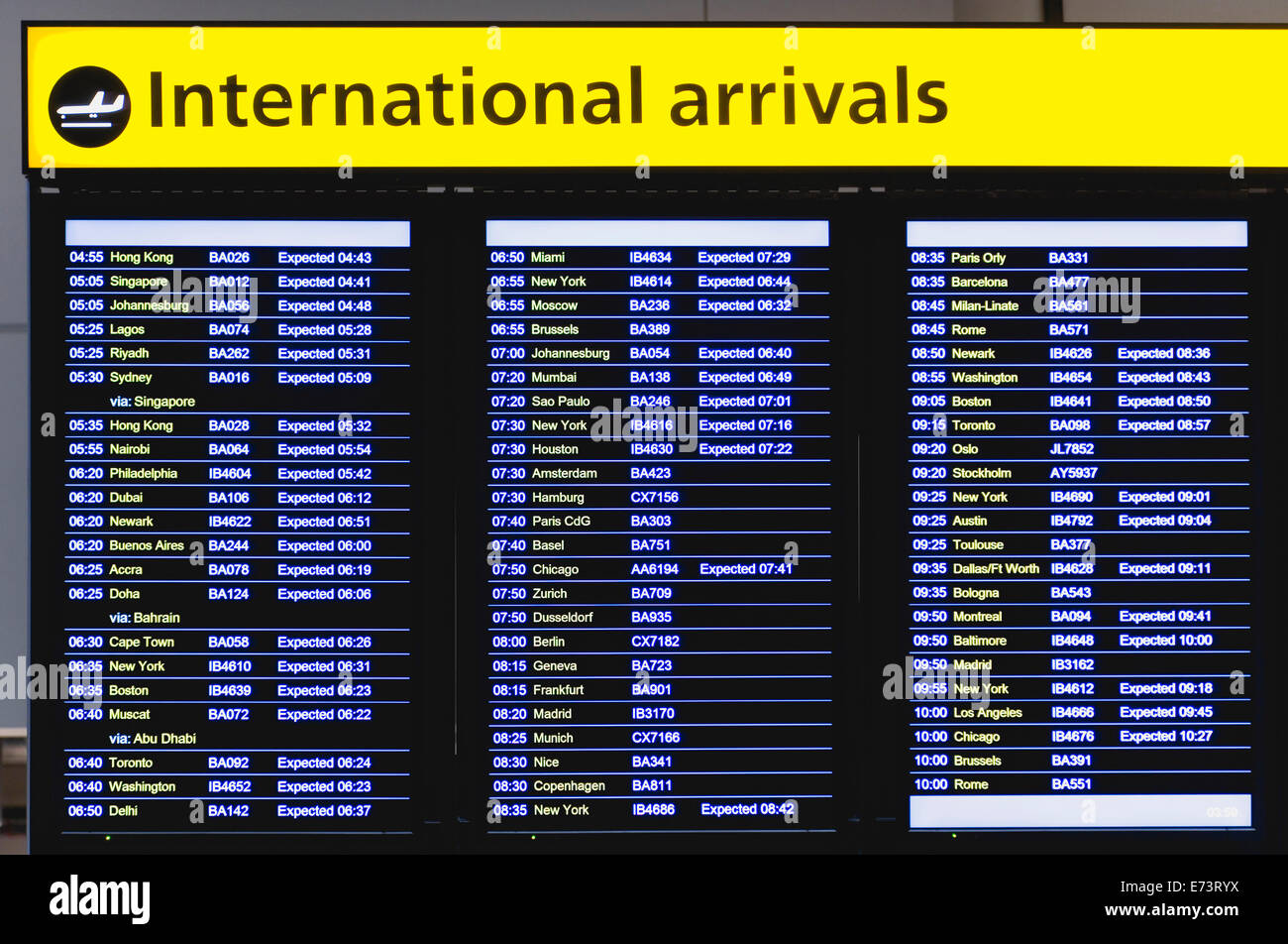 England, London, Heathrow Airport, International Arrivals hall in Terminal 5 T5 with electronic arrivals board. Stock Photo