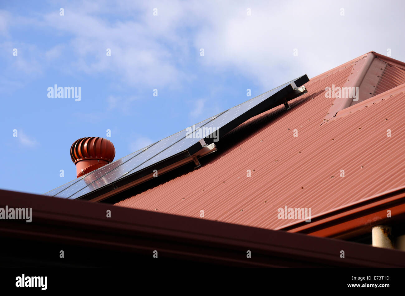 Australian photovoltaic solar power panels on suburban house roof. Stock Photo