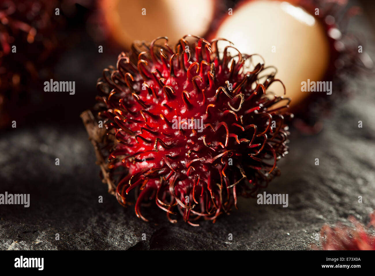 Fresh Organic Tropical Rambutan on a Background Stock Photo