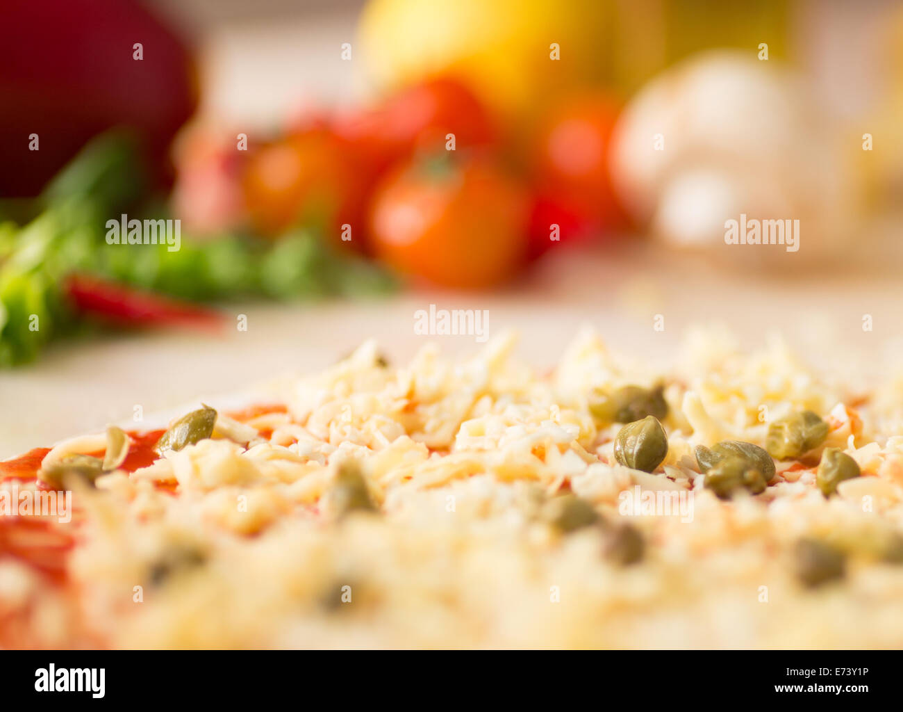 raw italian pizza with capers Stock Photo