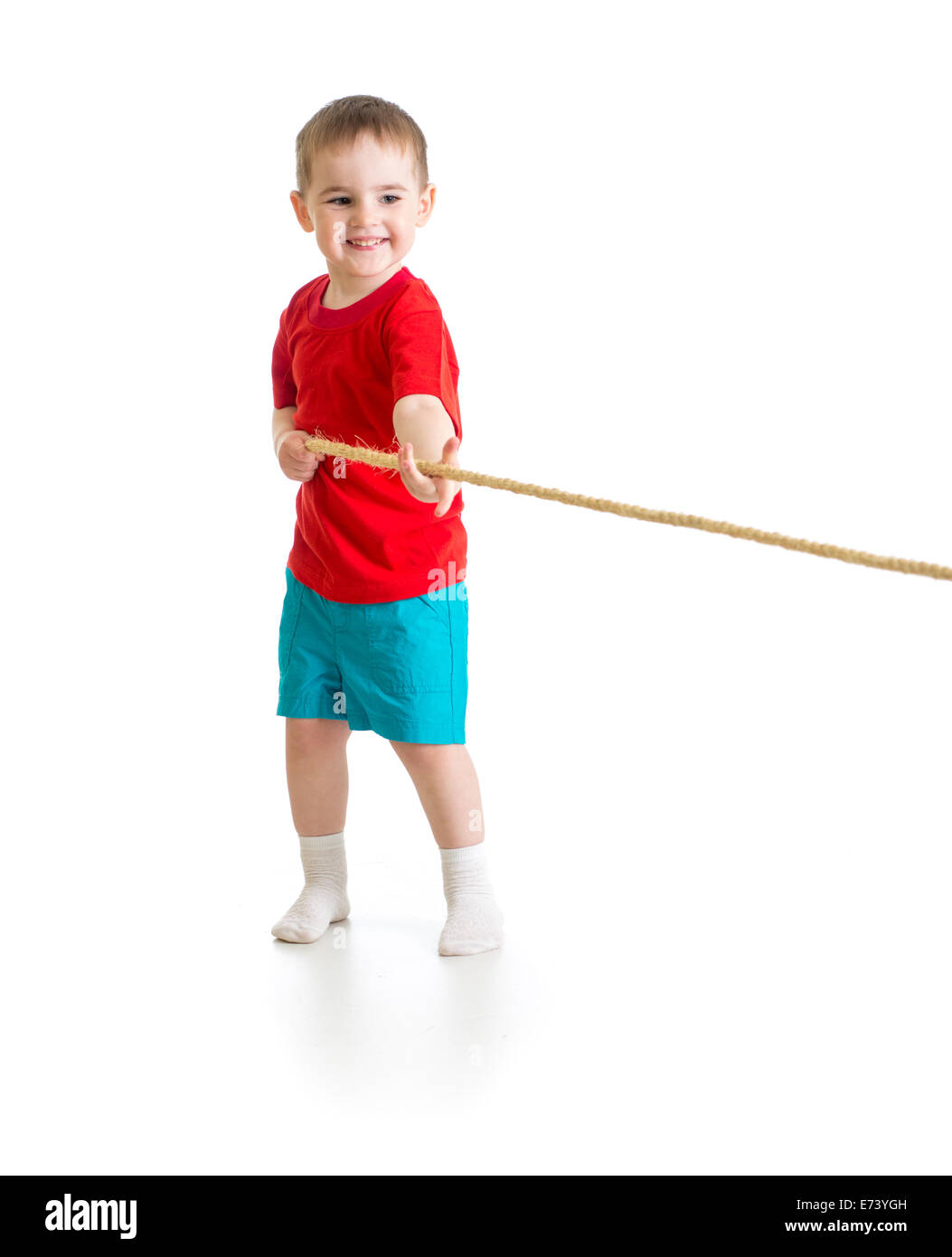 Liitle boy pulling rope isolated on white Stock Photo