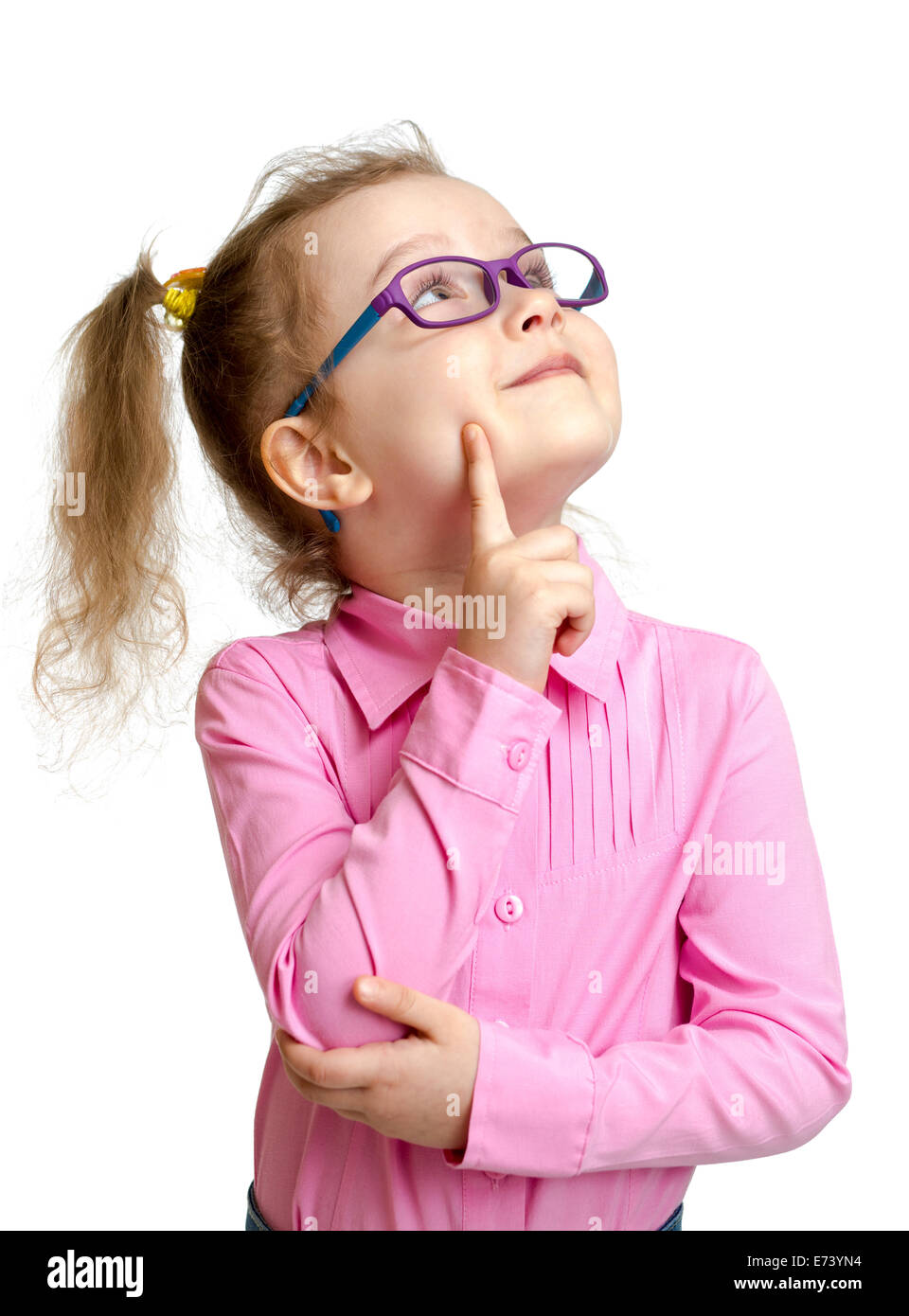 Adorable child in glasses looking up isolated on white Stock Photo