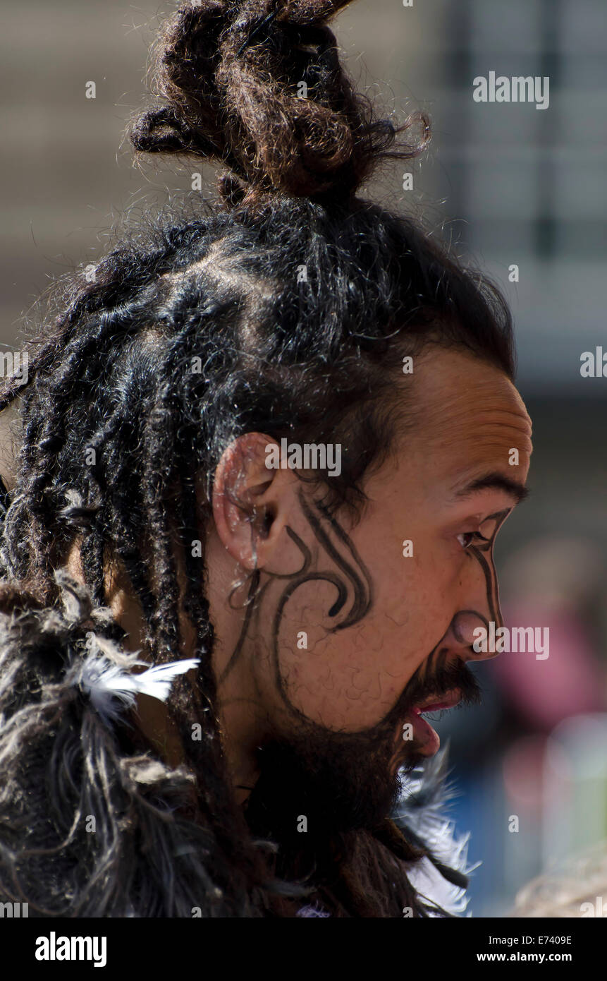 Maori man in warrior make-up promoting a show at the annual Festival Fringe in Edinburgh, Scotland. Stock Photo