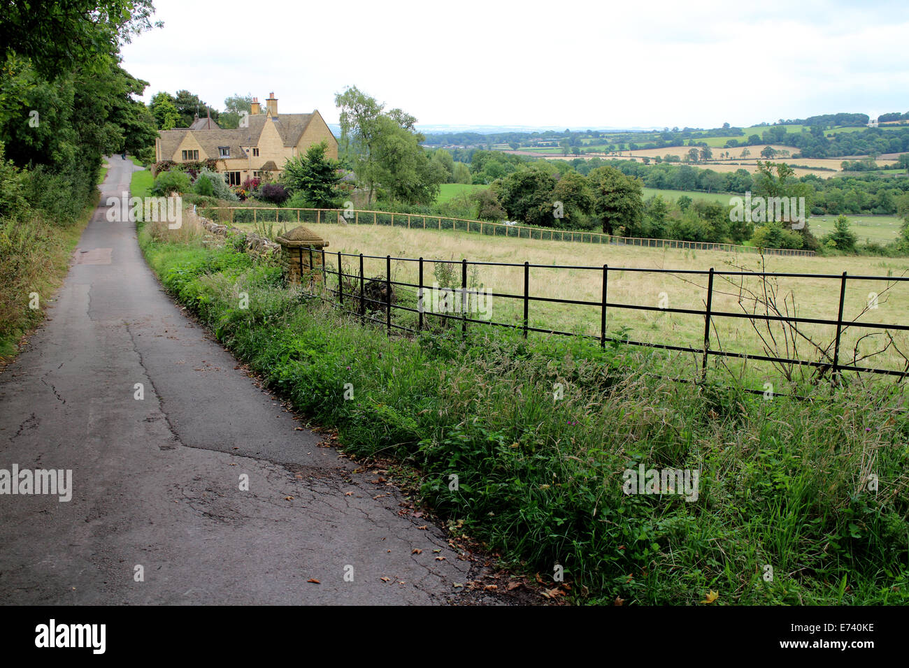 A Country Lane In Maugersbury Gloucestershire England UK Stock Photo a-country-lane-in-maugersbury-gloucestershire-england-uk-stock-photo