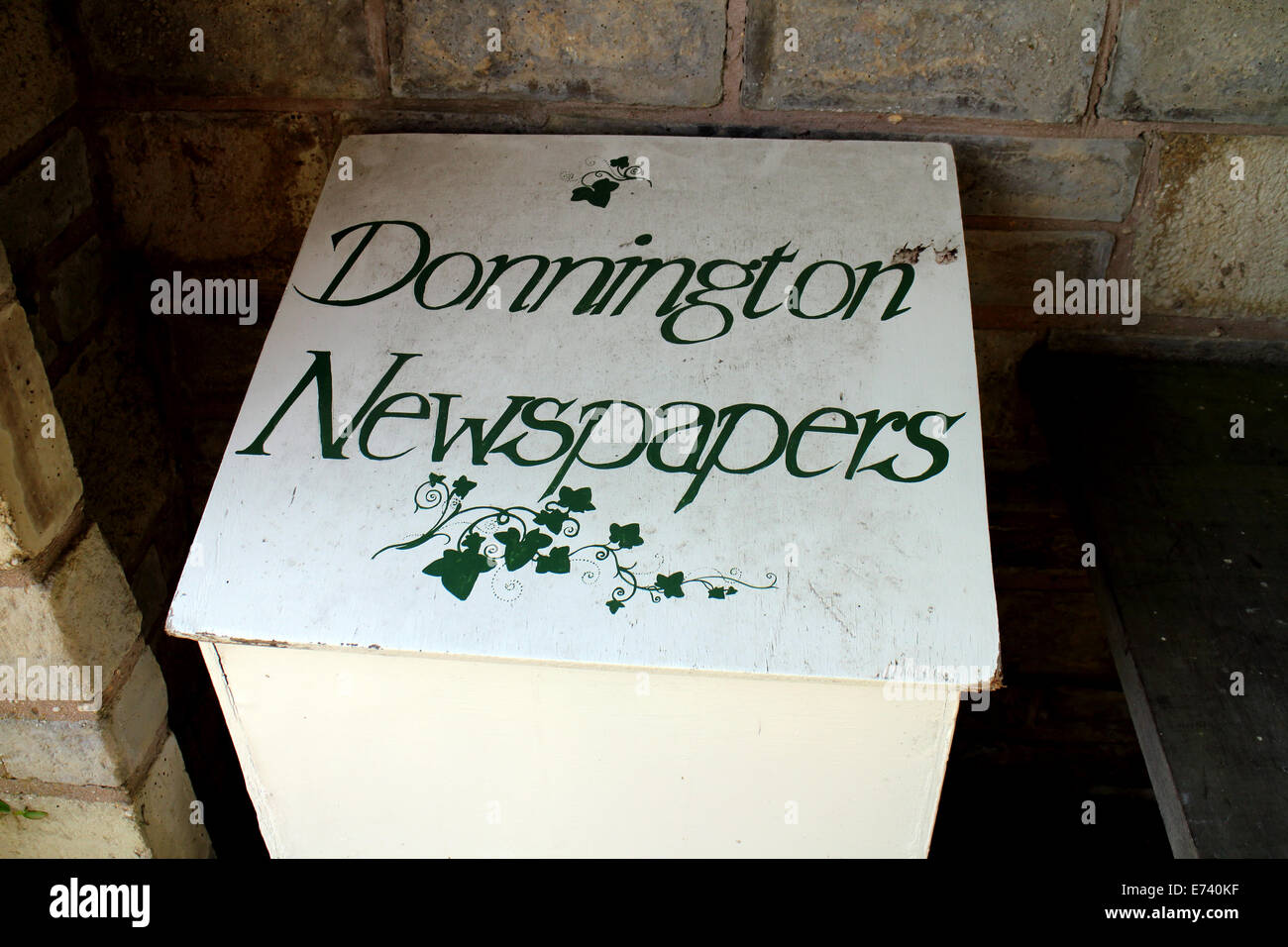 Newspapers box in bus shelter, Donnington, Gloucestershire, England, UK Stock Photo