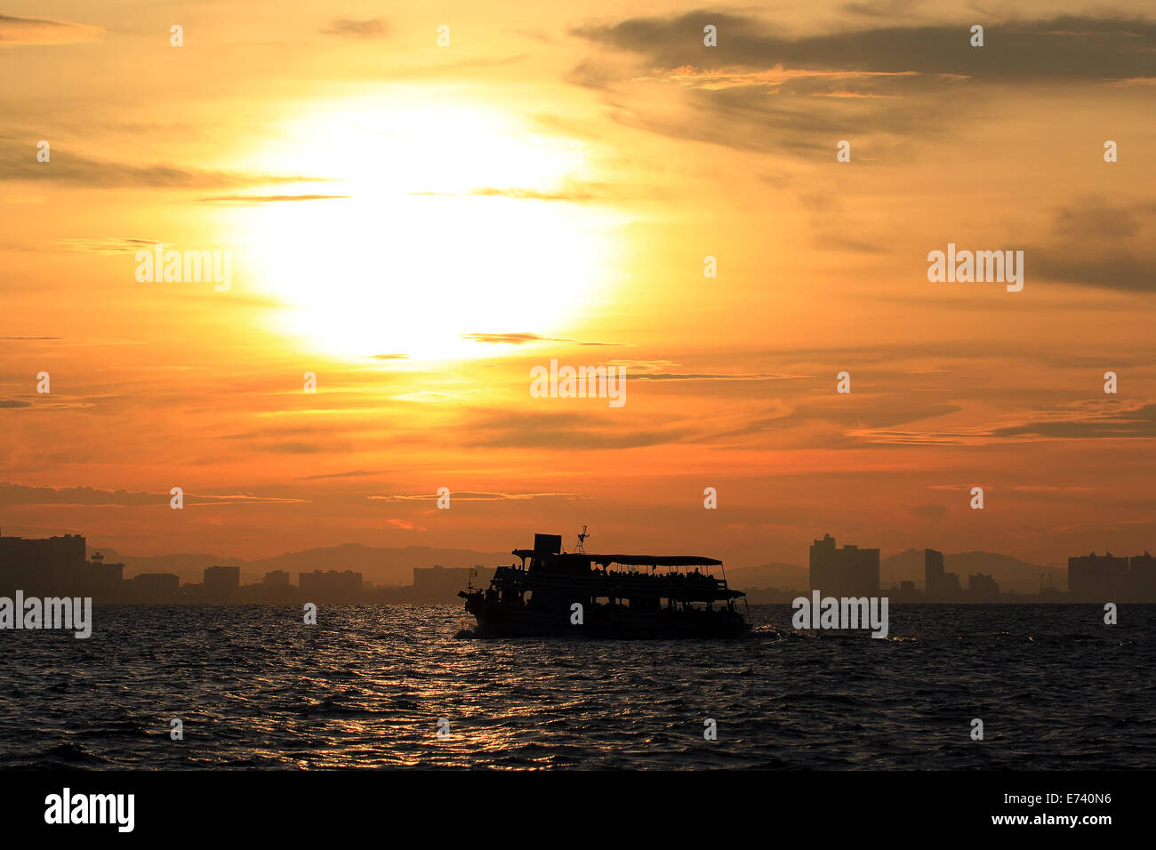 Silhouette of ship in the sea at sunset Stock Photo - Alamy