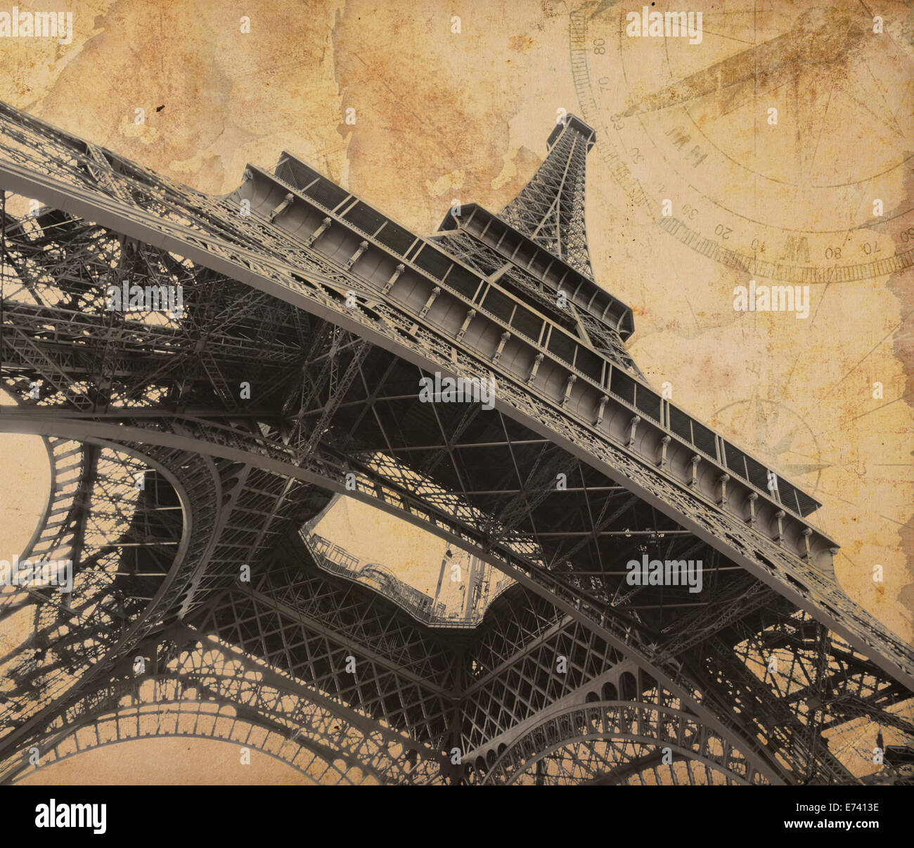 Eiffel tower over old adventure map Stock Photo
