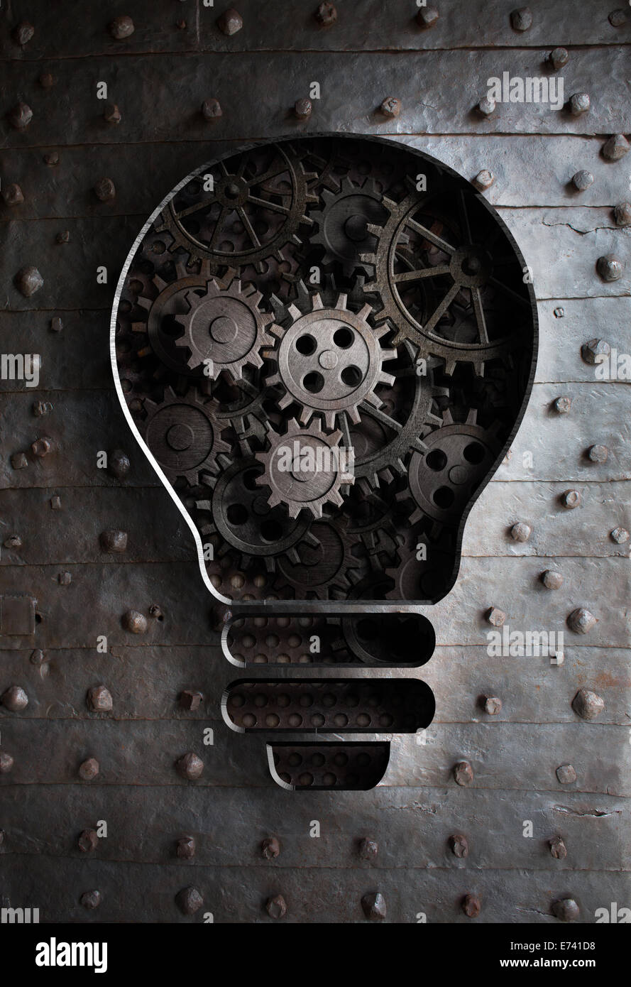 concept idea: bulb with working gears and cogs Stock Photo