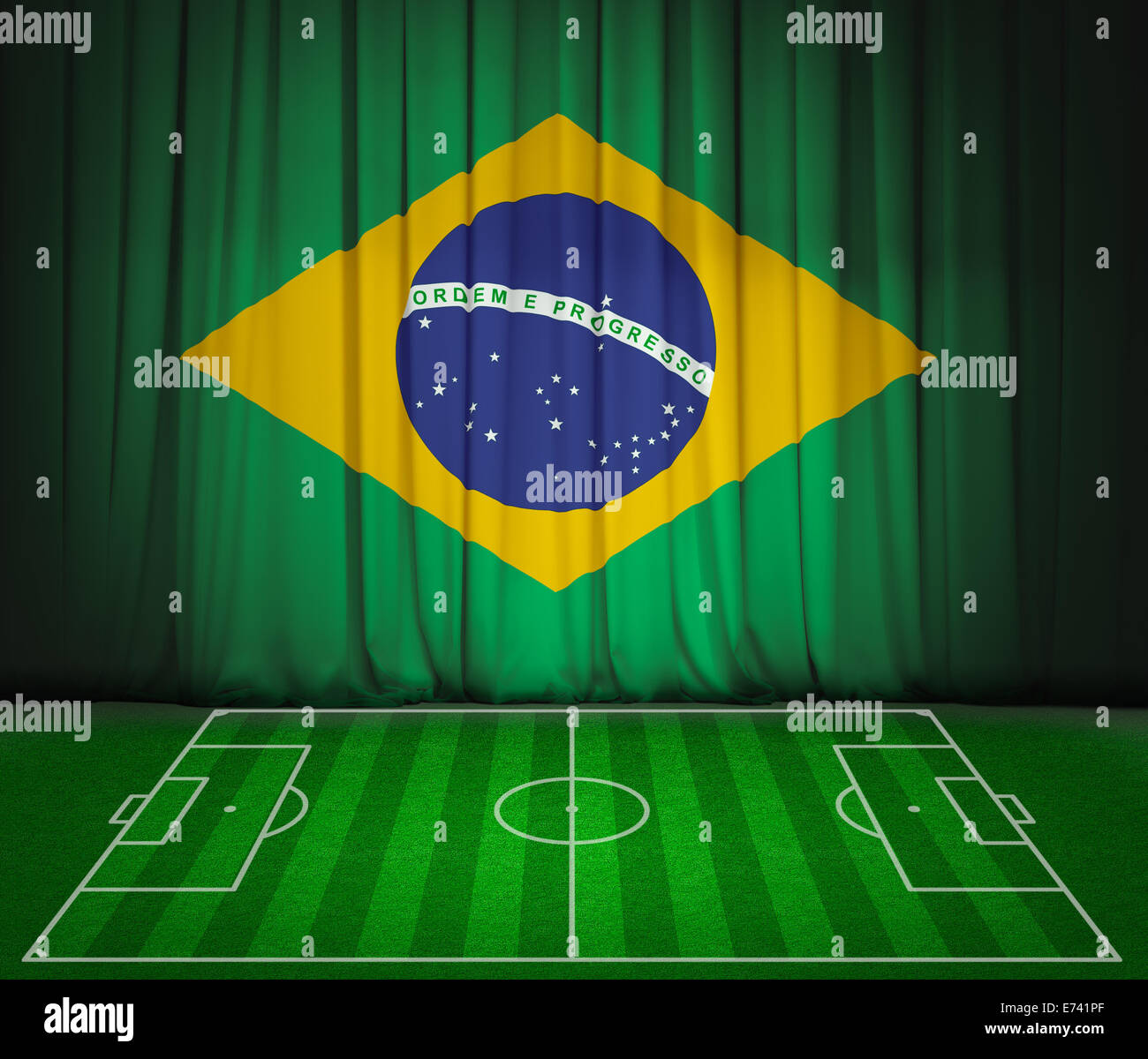 Soccer field with flag of Brazil on green curtain Stock Photo