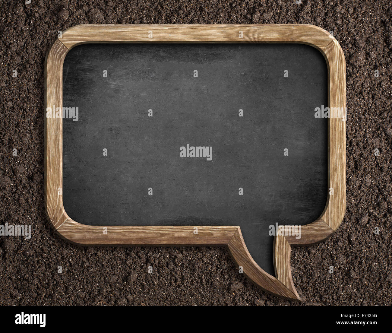 Blank blackboard on soil for sowing advice or text message Stock Photo